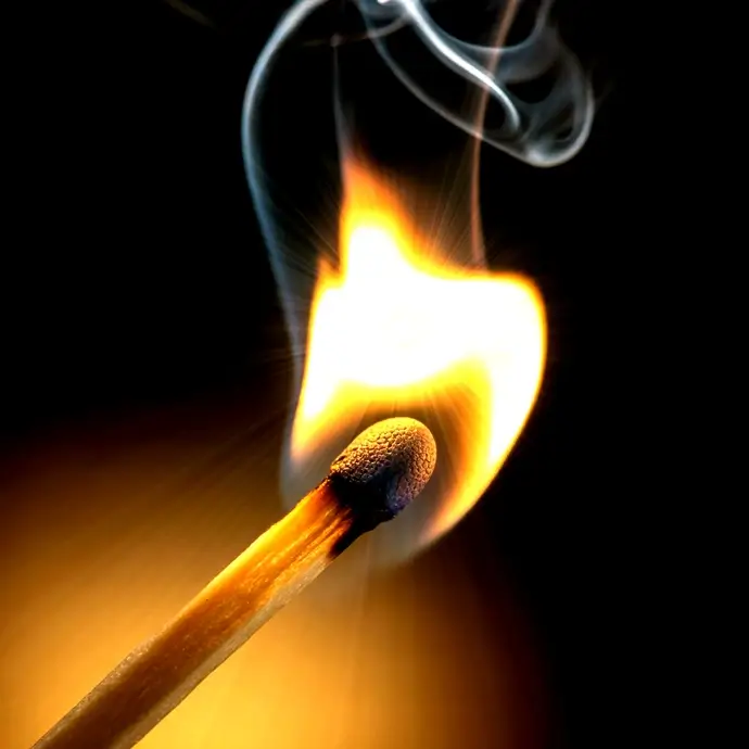 A single lit match representing Fire Training