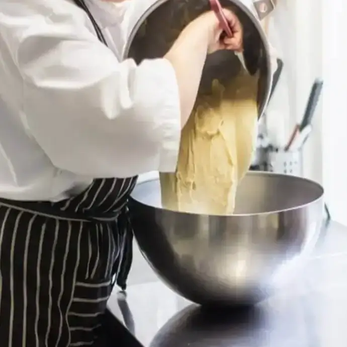 Chef aware of food hygiene working in a commercial kitchen