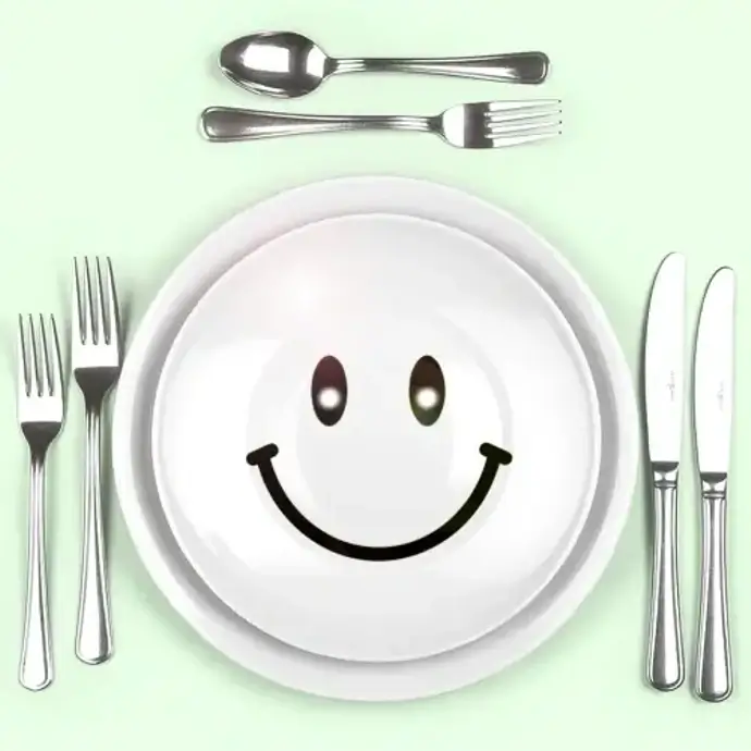 Food place setting with a smiley face