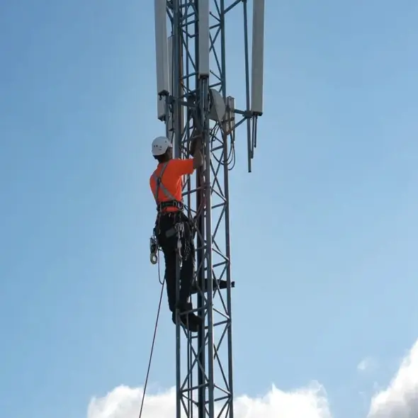 Man working on telecommunications tower