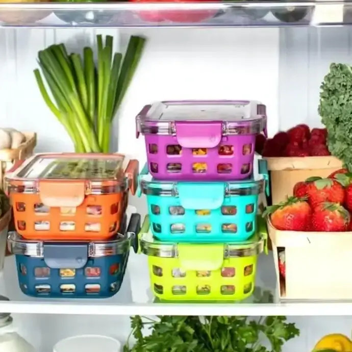 Food stored on the correct shelves in a refrigerator showing good fridge storage &amp; maintenance